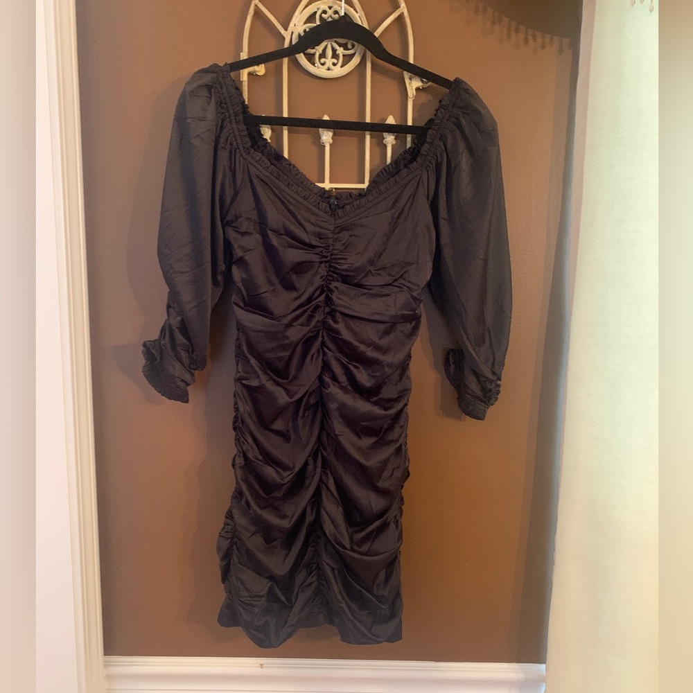 Flattering rouched black dress. Think Holidays / New Years Eve!